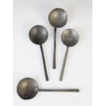 Four pewter slip top spoons, 19th century, of typical form, the circular bowls with touch marks at