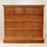 A late 19th century oak Aesthetic movement chest of drawers, the quarter veneered pollard oak top