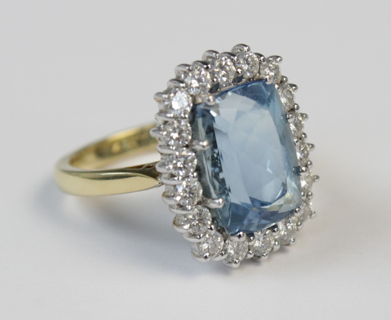 An aquamarine and diamond 18ct gold cluster ring, the central rectangular mixed cut aquamarine ( - Image 3 of 7