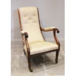 A Victorian mahogany and upholstered open armchair, the angled button back extending to curved