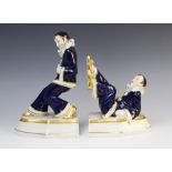 A pair of Royal Dux Pierrot bookends, one modelled leaning, the other with his feet in the air, each