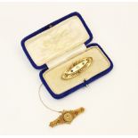 A Victorian 15ct gold diamond set Etruscan bar brooch, Chester 1895, the central round old cut