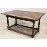 A 17th century and later oak table, the cleated three plank top raised upon ring turned supports and