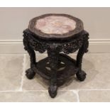 An early 20th century Chinese huanghuali and rouge marble urn stand, the scalloped circular top