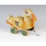 A Steiff pull-along duckling soft toy, mid 20th century, the stuffed mohair body with felt feet
