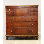 A mid 19th century mahogany chest of drawers, the rectangular thumb moulded top over a secret frieze