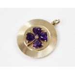 A 14ct gold amethyst 'lucky' clover pendant, the central raised clover motif comprising four heart-