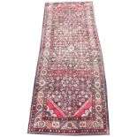 A thick pile deep ground Iranian runner, with traditional medallion design, 310cm x 123cm