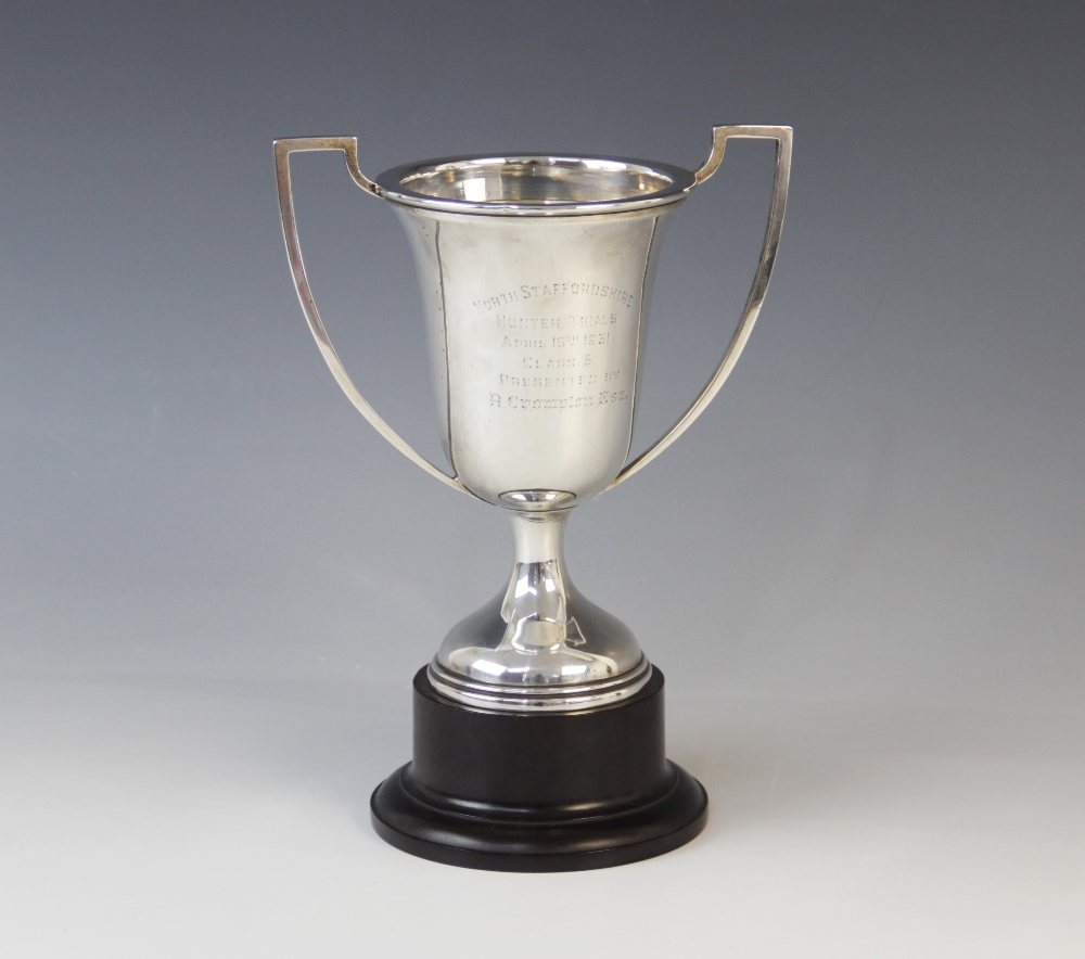 A George V silver twin-handled trophy cup by Alexander Clark & Co Ltd, Birmingham 1930, the bell
