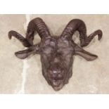 A cast iron wall hanging rams mask, 20th century, cast in naturalistic form, with a rear hanging