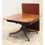 A Regency mahogany single pedestal extending dining table, the rectangular top with a reeded edge