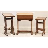 A Victorian oak prayer lectern, the angled book rest raised upon trestle type supports, carved