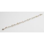 A 9ct gold cultured pearl set bracelet, comprising eight diamond-shaped scrolling 9ct gold links