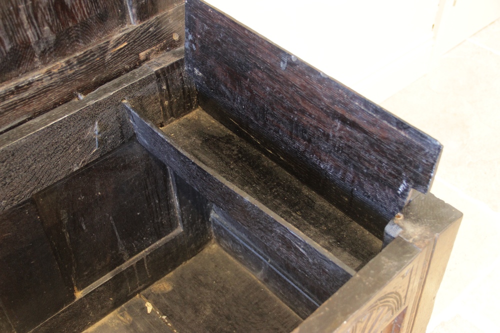 A late 17th/early 18th century oak coffer, the three panel top opening to a fitted candle box, above - Image 3 of 3