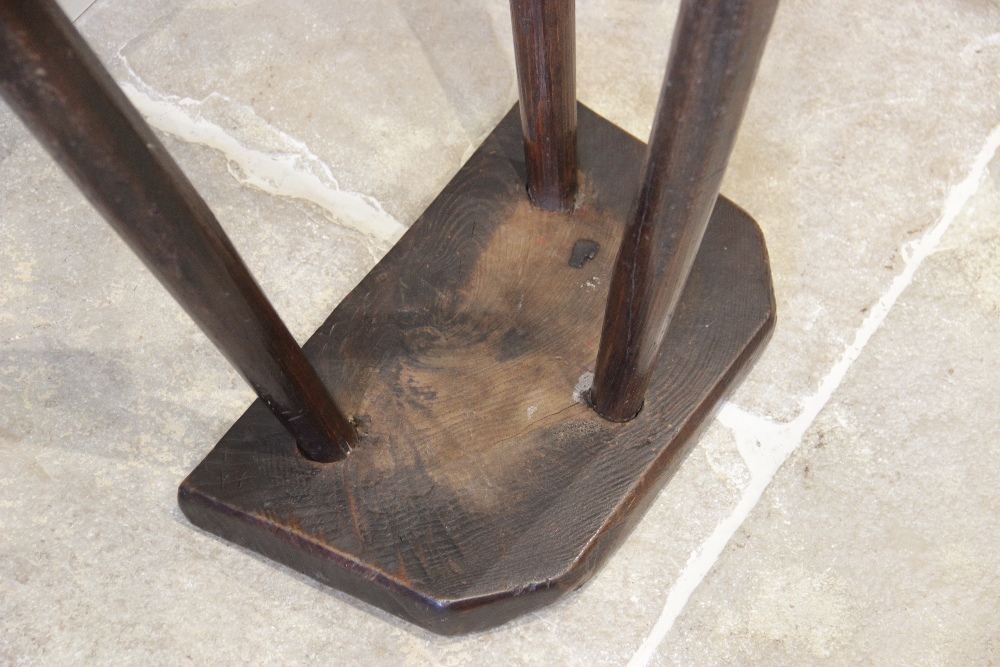 An early 19th century ash and elm primitive cutlers stool, the rough cut slab top raised upon - Image 4 of 5