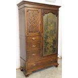 An early 20th century Art Nouveau oak compactum wardrobe by Goodall, Lamb and Heighway,