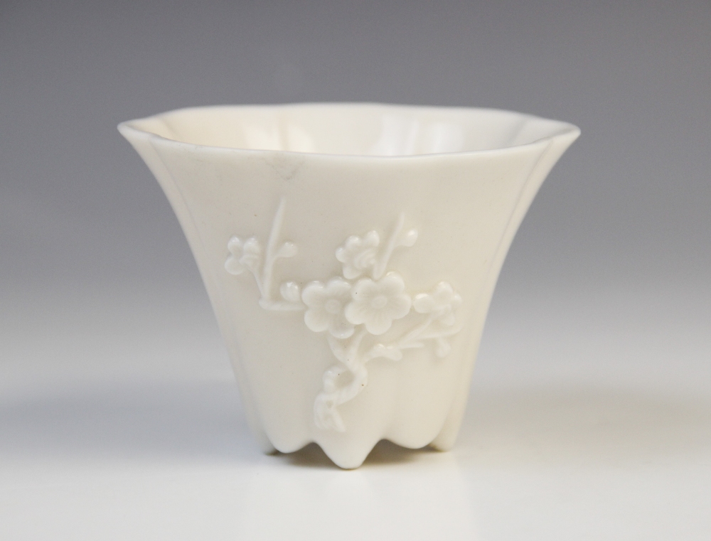 A Chinese blanc de chine Dehua porcelain libation cup, probably 19th century, of lobed spreading