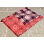 A Welsh blanket, of traditional reversible geometric design in red, white, blue and black with