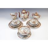 A Japanese satsuma ware part tea service, comprising: a teapot and cover, a sucrier and cover, a