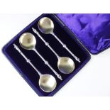 A Victorian cased set of four silver and silver gilt apostle spoons by Army & Navy Co-operative