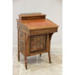 A late Victorian rosewood Davenport, the rectangular hinged top with a gilt metal baluster gallery