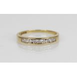 An 18ct gold diamond set half-eternity ring, comprising nine round brilliant cut diamonds, total (