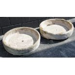 A pair of shallow circular reconstituted stone troughs, 17cm H x 75cm D (2)
