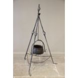 A wrought iron gypsy cauldron and tripod, 20th century, the three supports with open work swelling