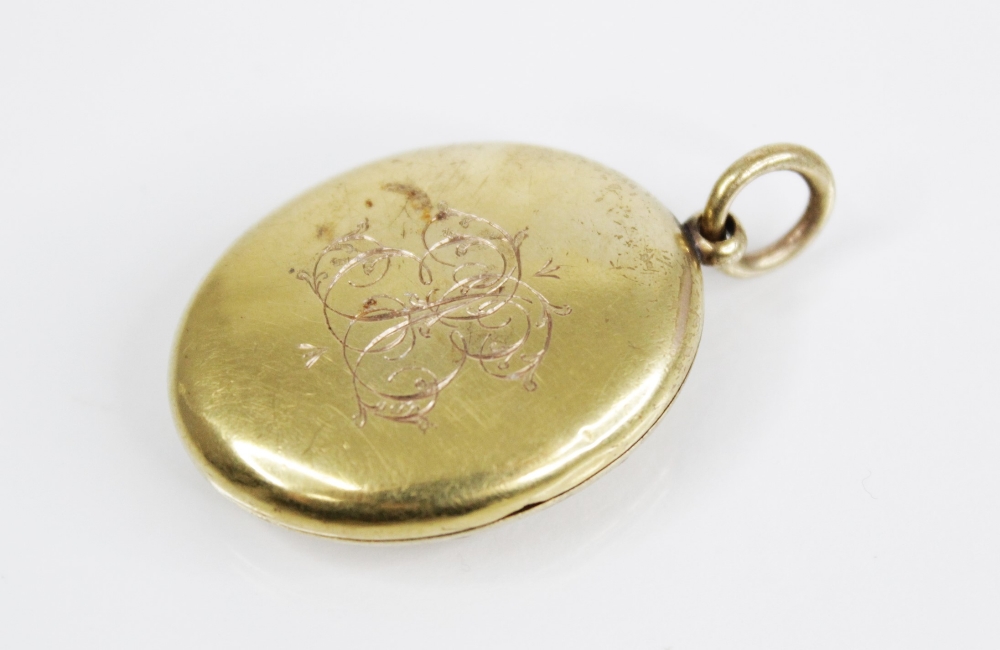 An early 20th century gold coloured enamelled locket pendant, the oval form locket with a blue - Image 2 of 8