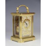 A gilt metal cased carriage timepiece signed Igor Carl Faberge, the 5cm silvered dial applied with a