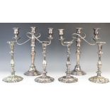 A pair of silver plated candelabras by Elkington & Co, each with tapering knopped columns on stepped