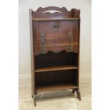 An early 20th century Glasgow school Arts and Crafts oak students bureau, the pierced three