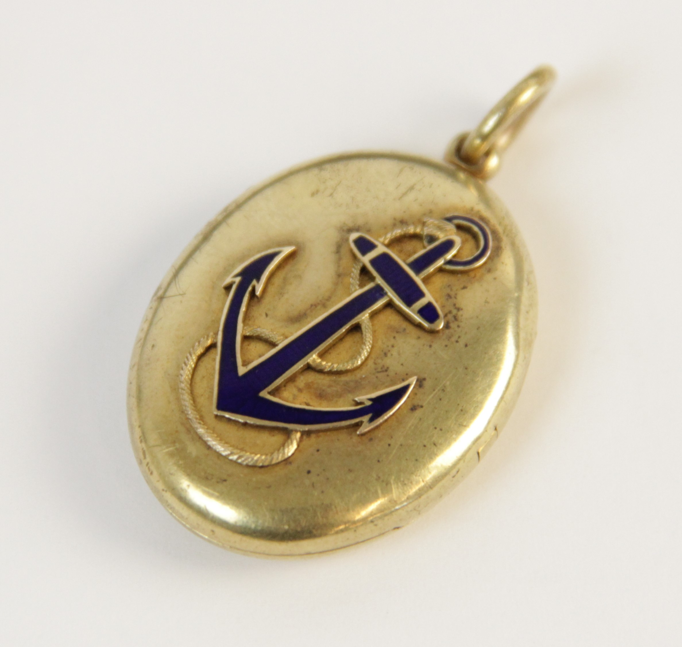 An early 20th century gold coloured enamelled locket pendant, the oval form locket with a blue - Image 4 of 8
