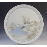 A Japanese porcelain 'Winter scene' charger, 20th century, of circular form with scalloped rim