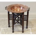 A 19th century copper brazier bowl, applied with brass side swing handles, upon an associated chip