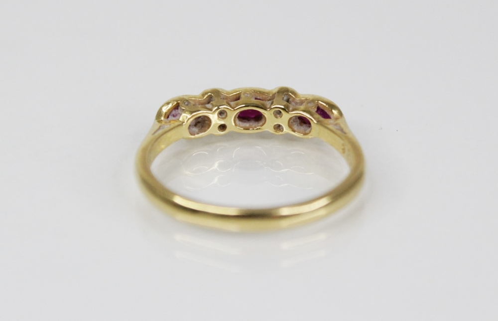 A ruby and diamond 18ct gold ring, comprising three (untested) oval mixed cut rubies, each - Image 3 of 6