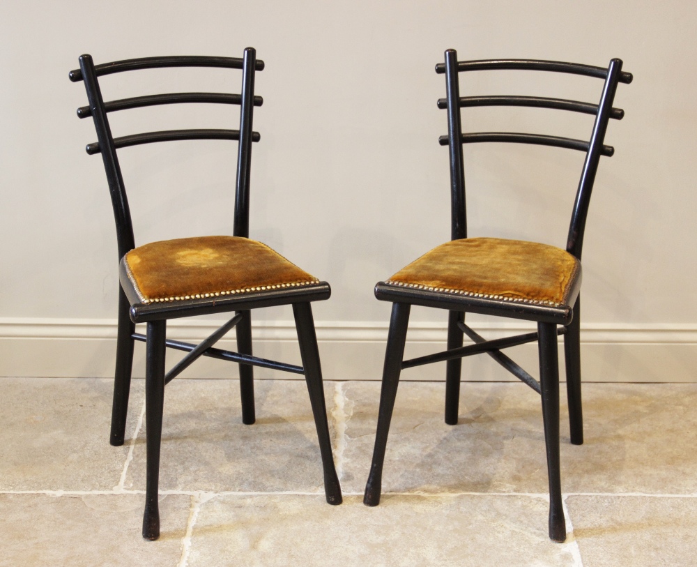 A pair of early 20th century German ebonised Arts and Crafts chairs by Michael Thonet, each chair