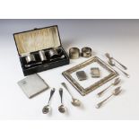 A selection of tableware and accessories, to include a George V cased three-piece silver cruet set