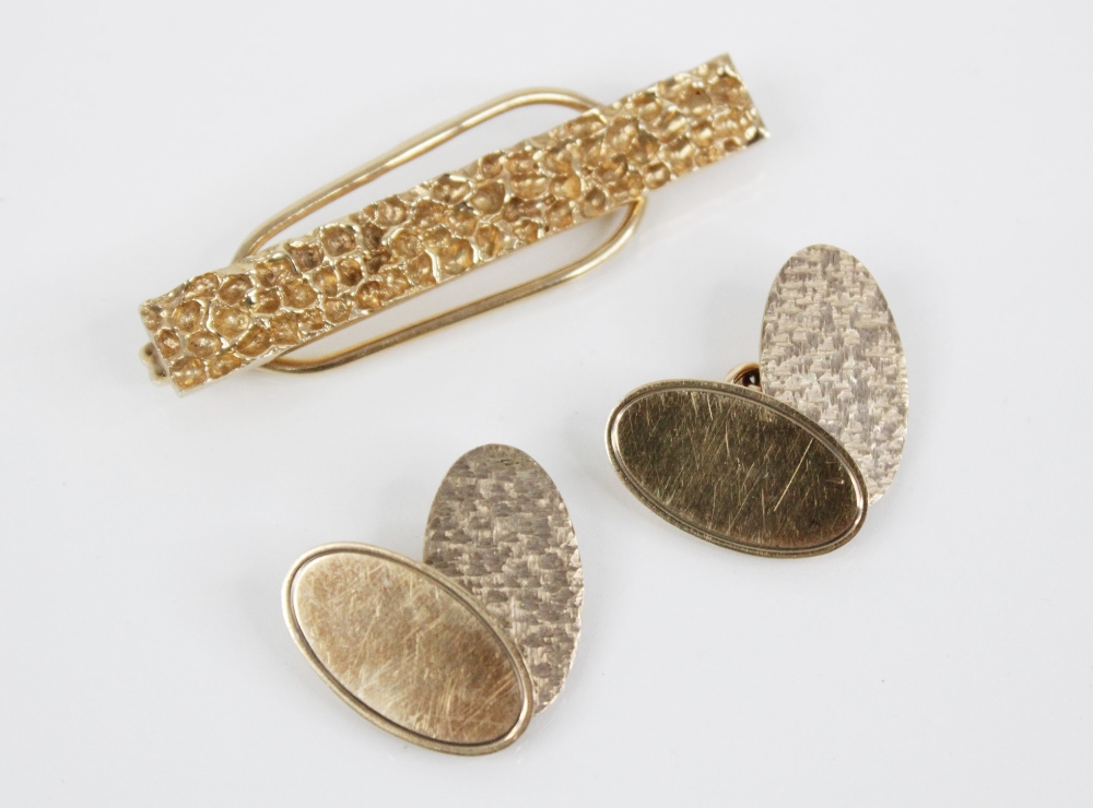 A pair of 9ct gold cufflinks by Cohen & Charles, Birmingham 1966, each designed as two oval