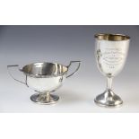 A twin-handled silver trophy cup Walker & Hall, Sheffield 1960, of circular form with cast rim and