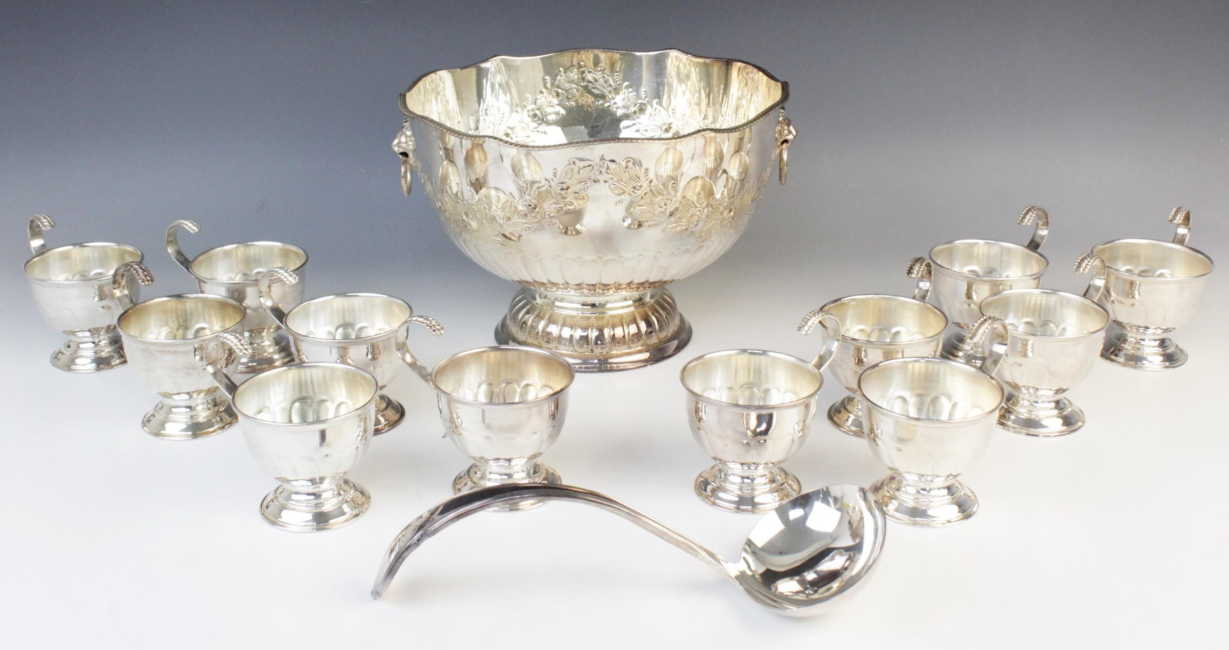 A mid-20th century silver plated punch bowl, of circular form with shaped rim and gadroon border