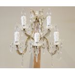 A French glass and gilt metal five branch wall light fitting, the twin dish shaped brackets