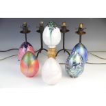 A collection of six lustre coloured glass lamp shades, each of egg form, various colours and designs