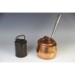 An 18th century iron money box, of hinged cylindrical form, with an overhead swing handle and