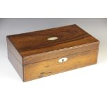 A Victorian rosewood writing box, the hinged cover centred with an oval mother of pearl cartouche,