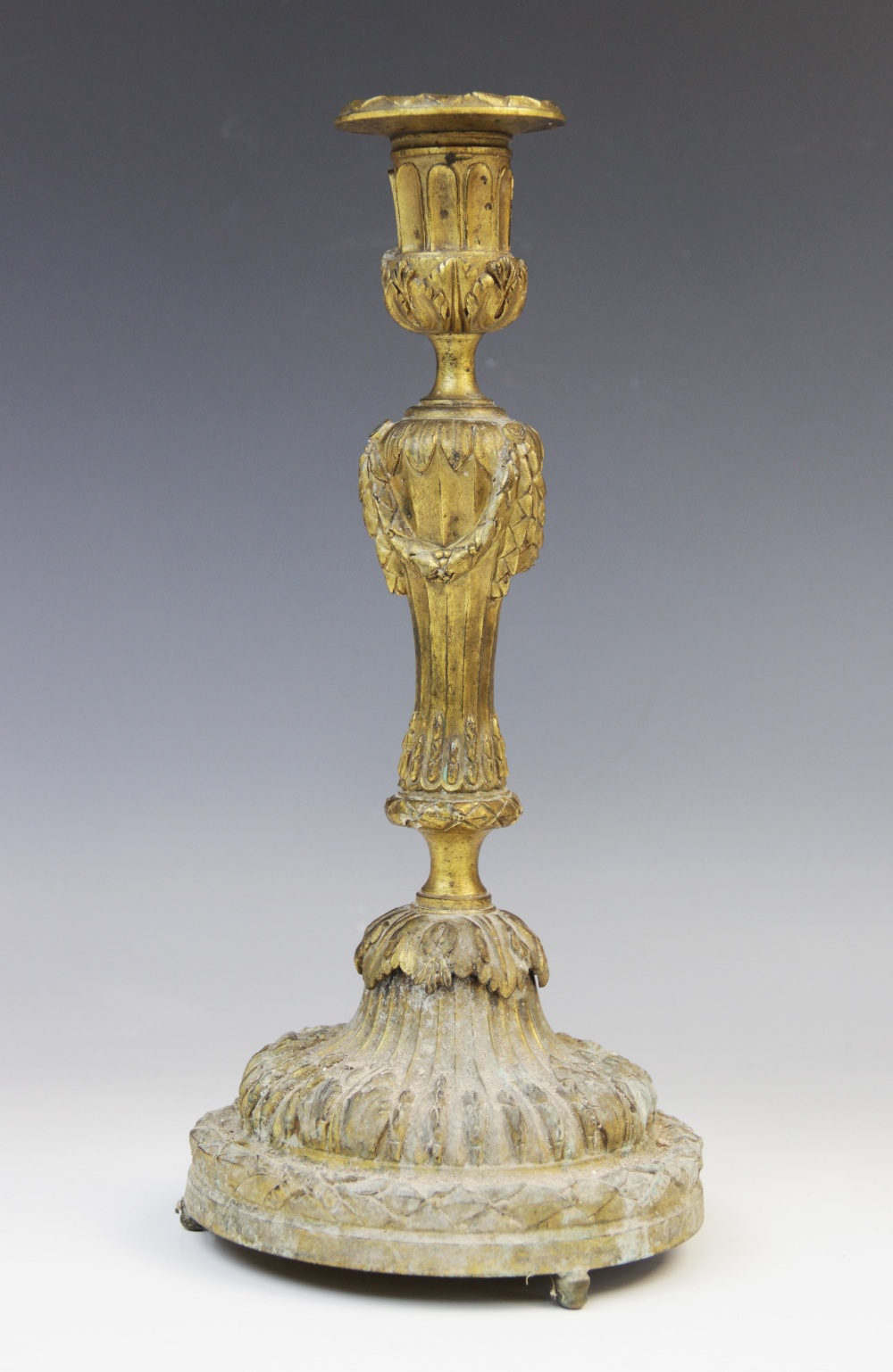 A Louis XVI style ormolu candlestick, early 19th century circa 1820, the flared sconce with