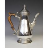 A George III silver hot water jug by Louise Black, London 1764, of baluster form on circular foot,