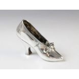 A Victorian silver model of a shoe by Edward H Stockwell, London 1890, marked to base 'Albert Barker