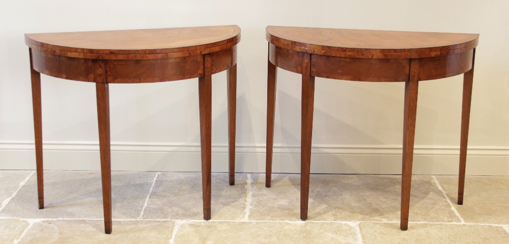 A pair of George III style mahogany folding tea tables, late 20th century, each of 'D' form with yew