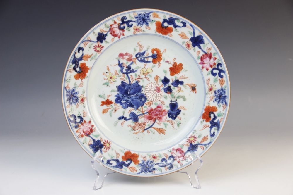 An 18th century Chinese Imari plate, the circular plate decorated with a central depiction of floral